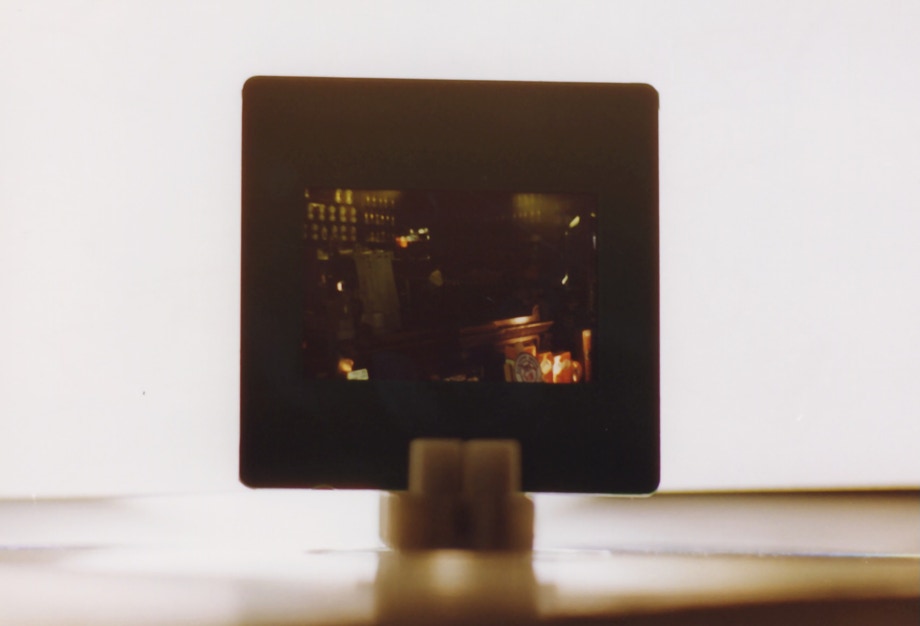 Slides — hands leafing through a CD of dias